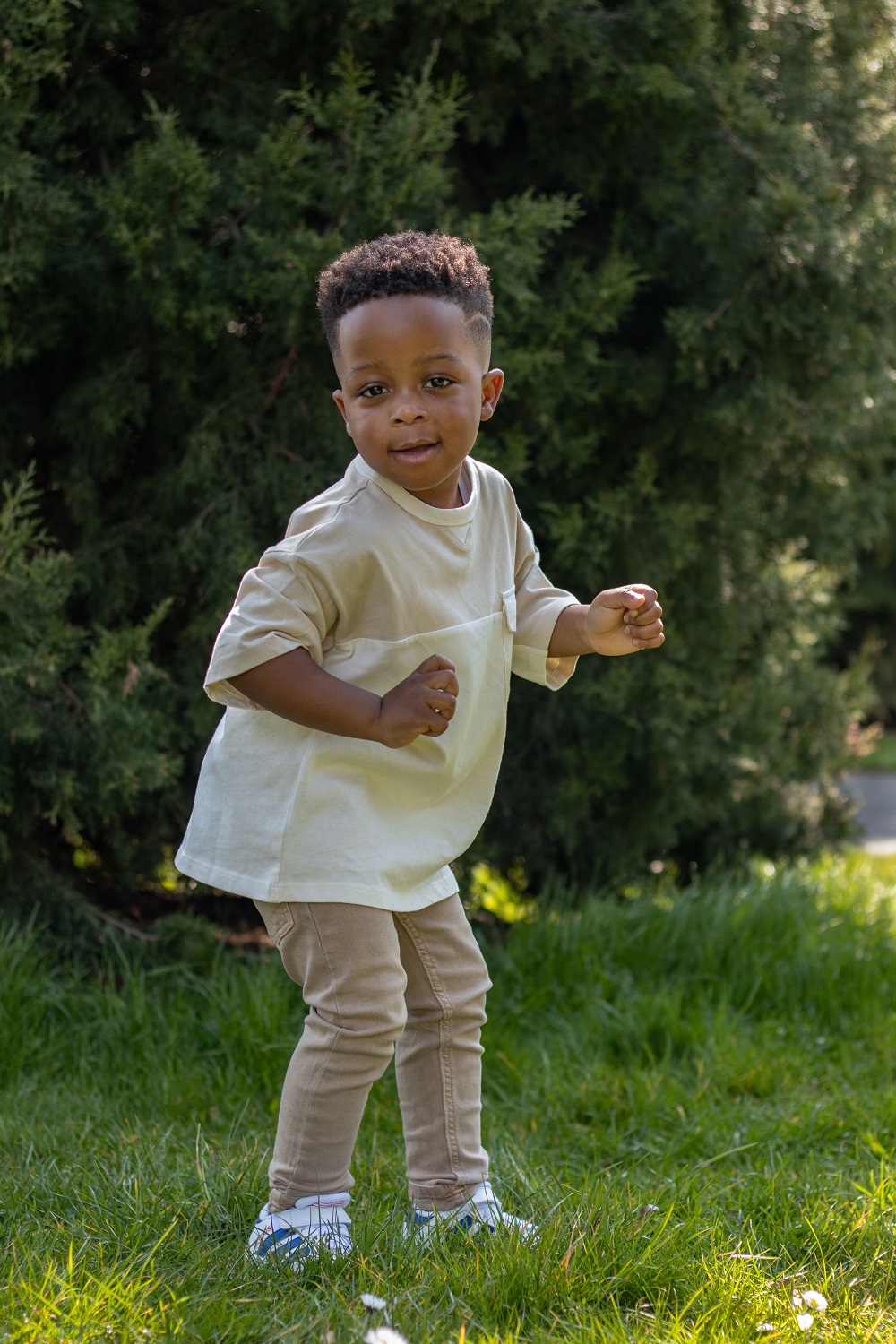 Young boy dancing in the park